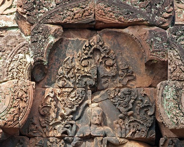 sm_banteisreigN1405 God Shiva with multiple arms depicted on the eastern gopura of the inner enclosure wall, Banteay Srei temple, Citadel of the Women, Angkor, Cambodia