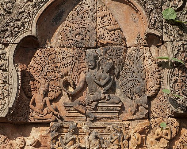 sm_banteisreigN1406 Shiva and Uma sitting on the summit of Mount Kailashi while the demon Ravana is shaking the mountain, part of the bas-relief of the east facing pediment of the...