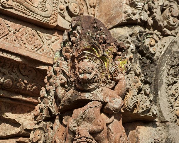 sm_banteisreigN1414 Fierce-looking mythical figure guarding the corners of the shrines, Banteay Srei temple, Citadel of the Women, Angkor, Cambodia