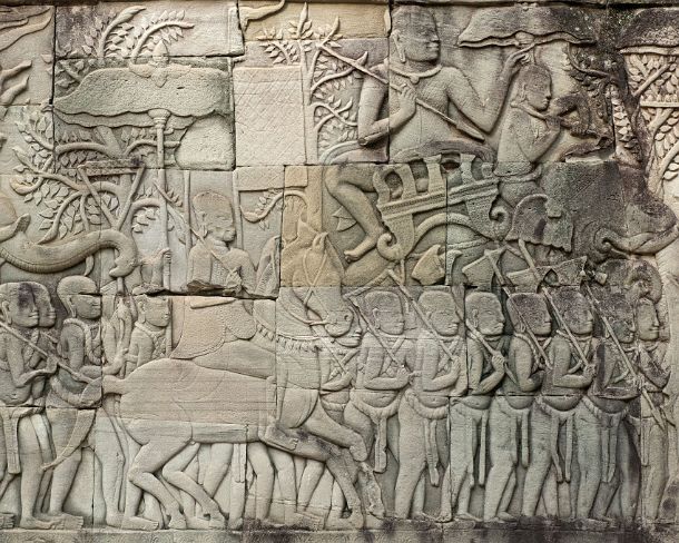 sm_bayonN1422 Stone carving depicting scenes from a military procession of the army of Jayavarman VII, the commanders of the troops are mounted on elephants, Bas-relief of...