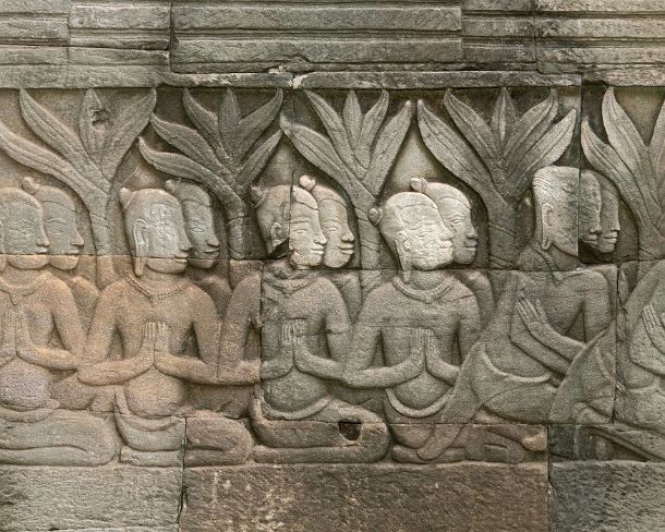 sm_bayonN1425 Bas-relief carved in stone depicting a group of worshipers, Outer gallery South-East Corner Pavillion, Bayon temple, Angkor Thom, Siem Reap, Cambodia