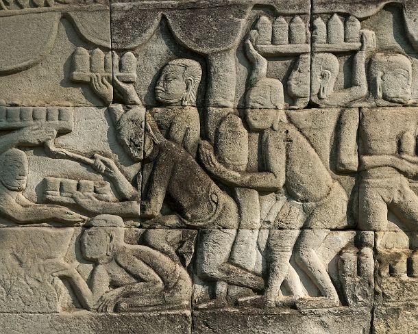 sm_bayonN1429 Bas-relief carved in stone depicting genre scenes of daily life along the shores of Tonle Sap, this panel shows cooks preparing food and drinks for the king who...