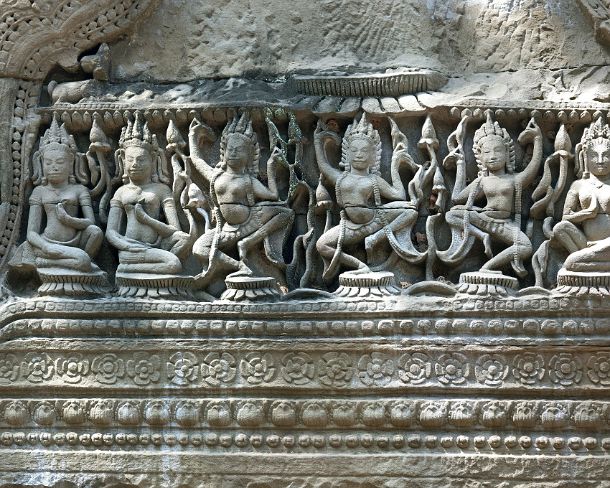 smpreakhanN1457 Carved sandstone lintel depicting apsaras, celstial dancers, at the of Hall of Dancers, Preah Khan temple, built by King Jayavarman VII in 12th century, Angkor,...