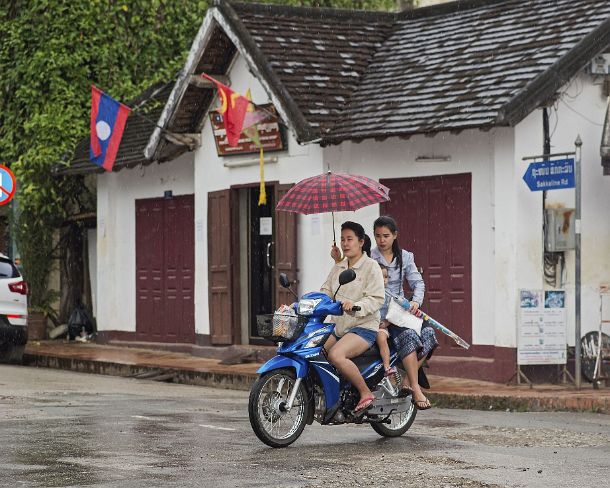 smLuangPN1502 Riding in the rain, Luang Prabang, Laos