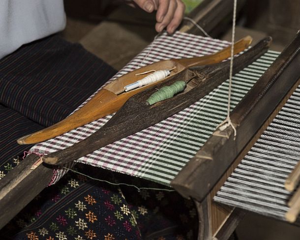 smLuangPN1509 Weaving on a traditional Lao-Thai style loom, Ban Phanom, Laos