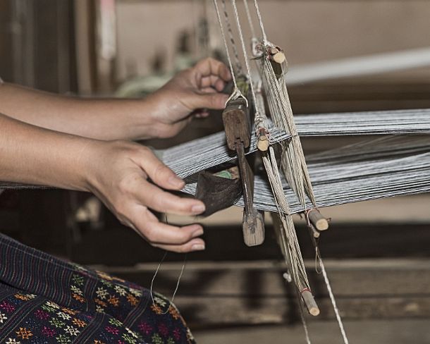 smLuangPN1510 Weaving on a traditional Lao-Thai style loom, Ban Phanom, Laos