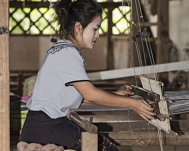 smLuangPN1549 Weaving on a traditional Lao-Thai style loom, Ban Phanom, Laos