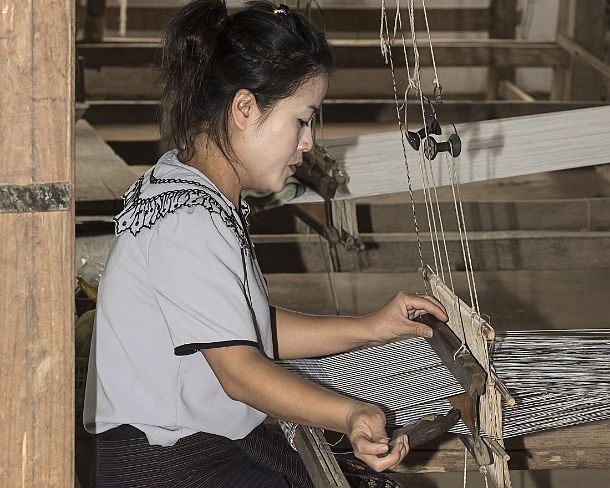 smLuangPN1552 Weaving on a traditional Lao-Thai style loom, Ban Phanom, Laos