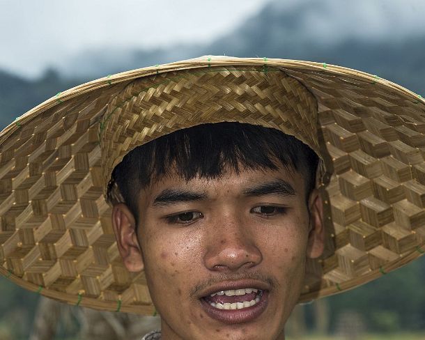 smLuangPN1538 Young farmer, rice farrm of the community enterprise Living Land, Ban Phong Van close to Luang Prabang, Laos