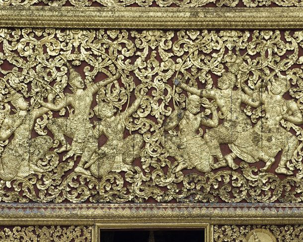 smLuangPtemplesN1571 Carved gilded teak wood panels depicting the Lao version of Ramayana story (Lao Pha Lak Pha Lam) amidst rich floral carving, Royal Funerary Carriage house,...