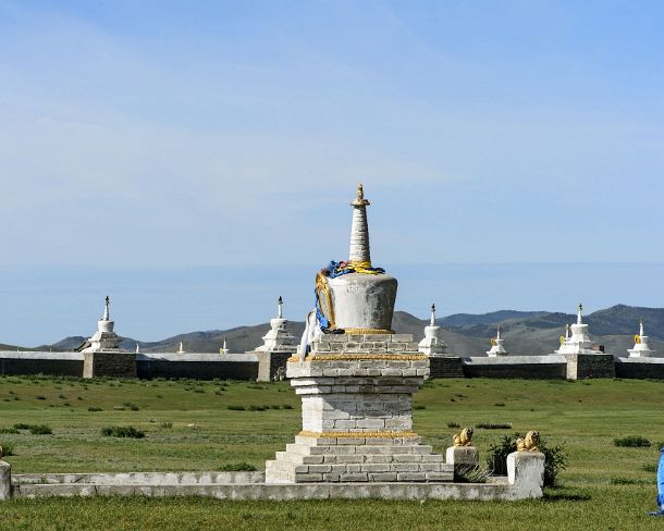 smMongolN1667 Soyombo stupa with two pairs of guardian lions outside of the enclosure wall of Erdene Zuu monastery, the earliest surviving Buddhist monastery in Mongolia,...