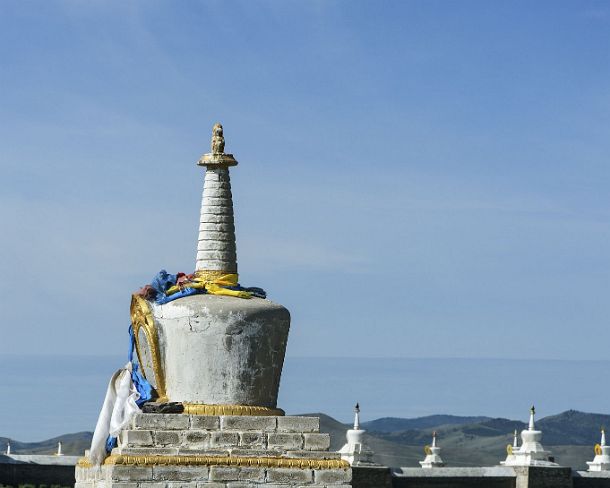 smMongolN1668 Soyombo stupa with guardian lions outside of the enclosure wall of Erdene Zuu monastery, the earliest surviving Buddhist monastery in Mongolia, located near...